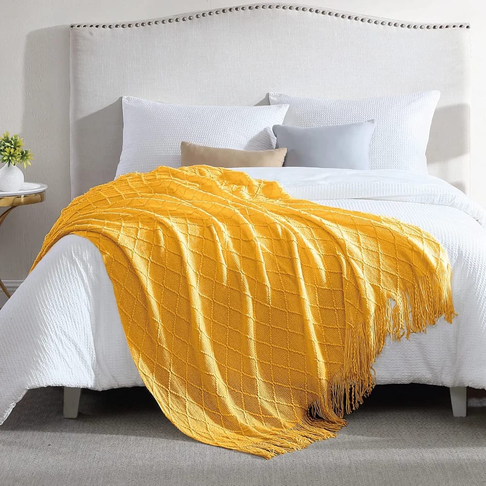 Knitted throw blankets with tassel