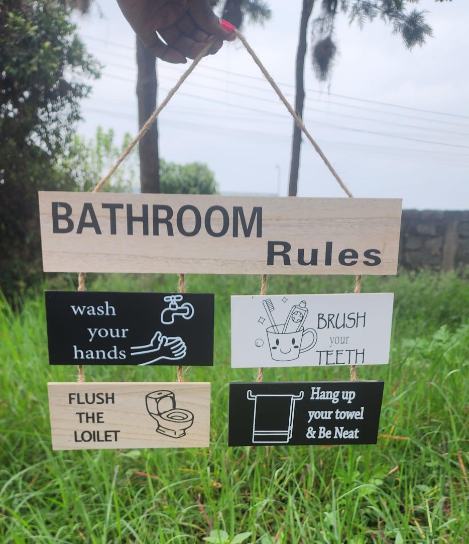 Wooden bathroom rules hanging