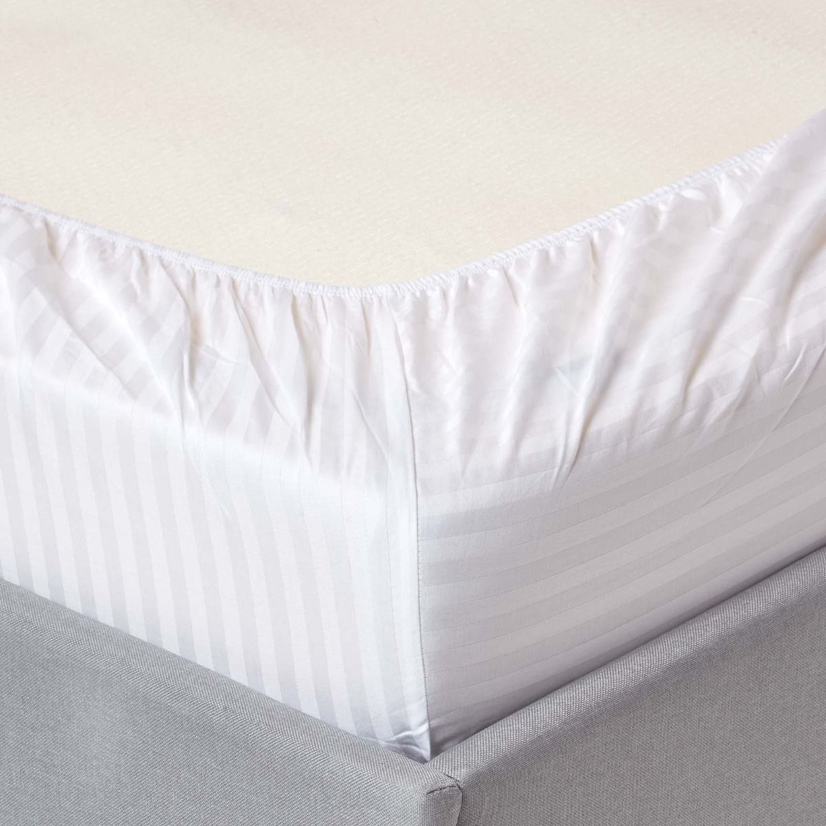 White stripped fitted white bedsheets