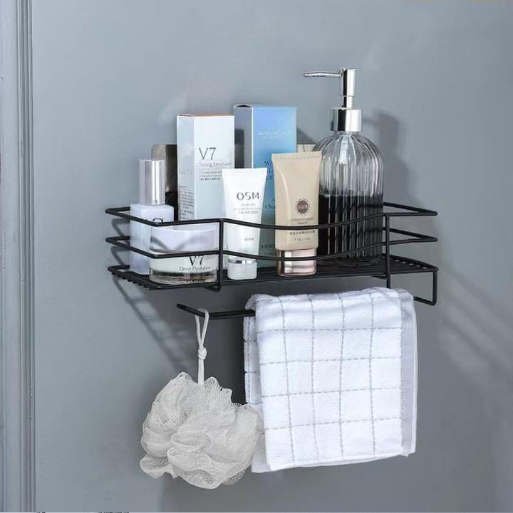 Wrought iron wall mounted storage rack .